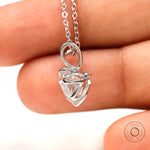 Refined tulip set round pendant in white gold