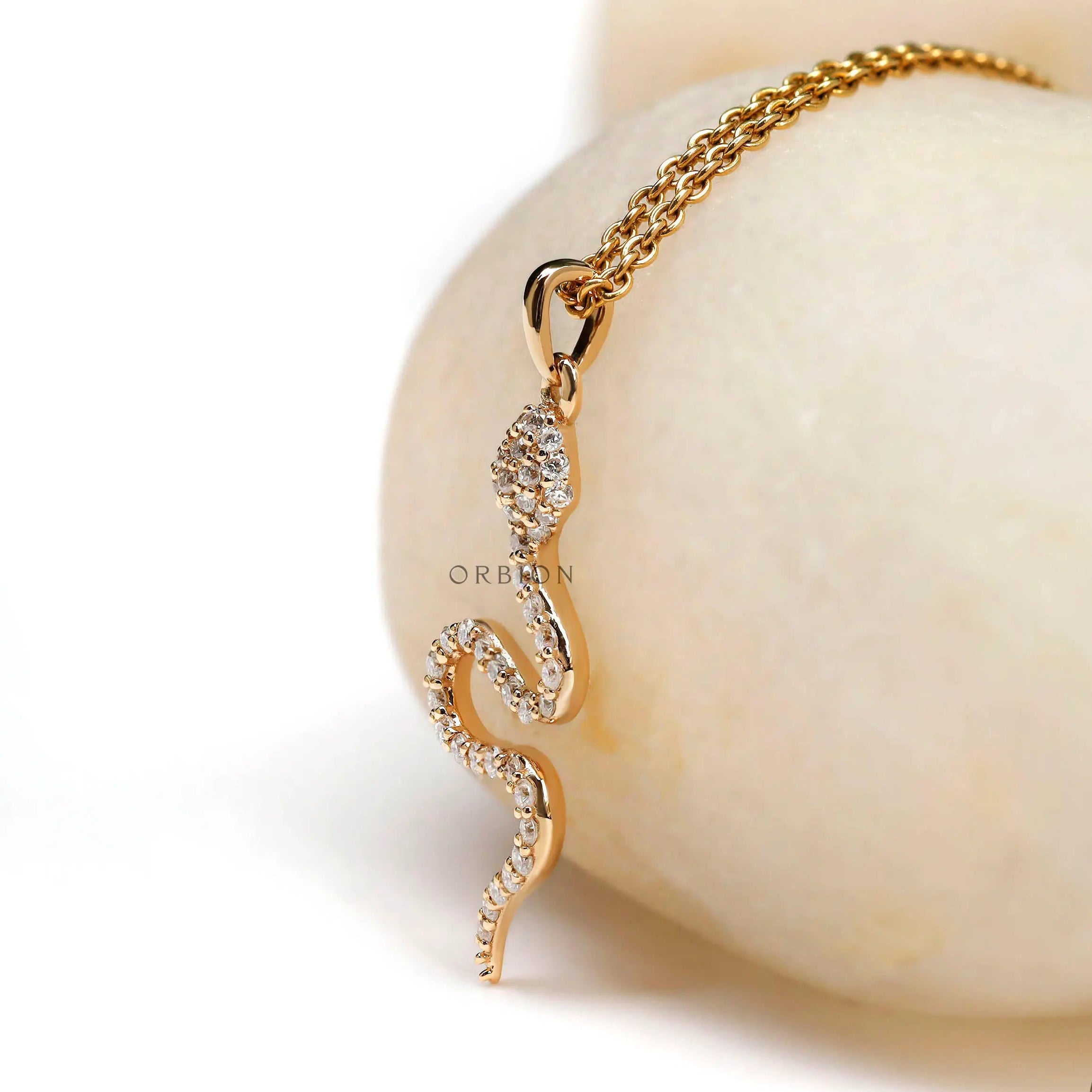 Diamond studded snake pendant charm