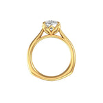 Elongated cushion moissanite solitaire in yellow gold, top view.