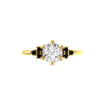 Round OEC center with black moissanite clusters in yellow gold.