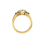 Side profile showing crown prongs and tapered 10K yellow gold band.