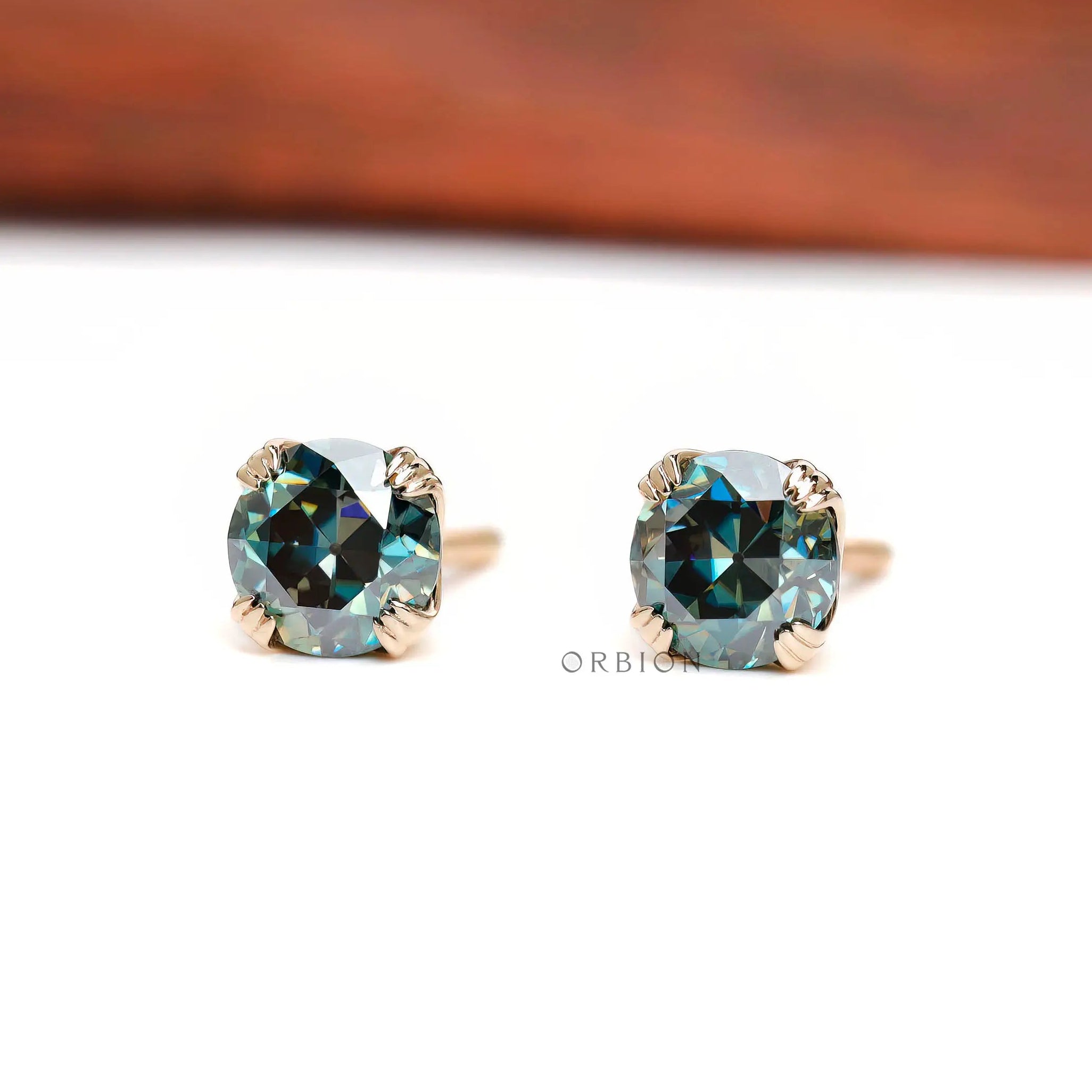 Vintage style round moissanite studs in yellow gold