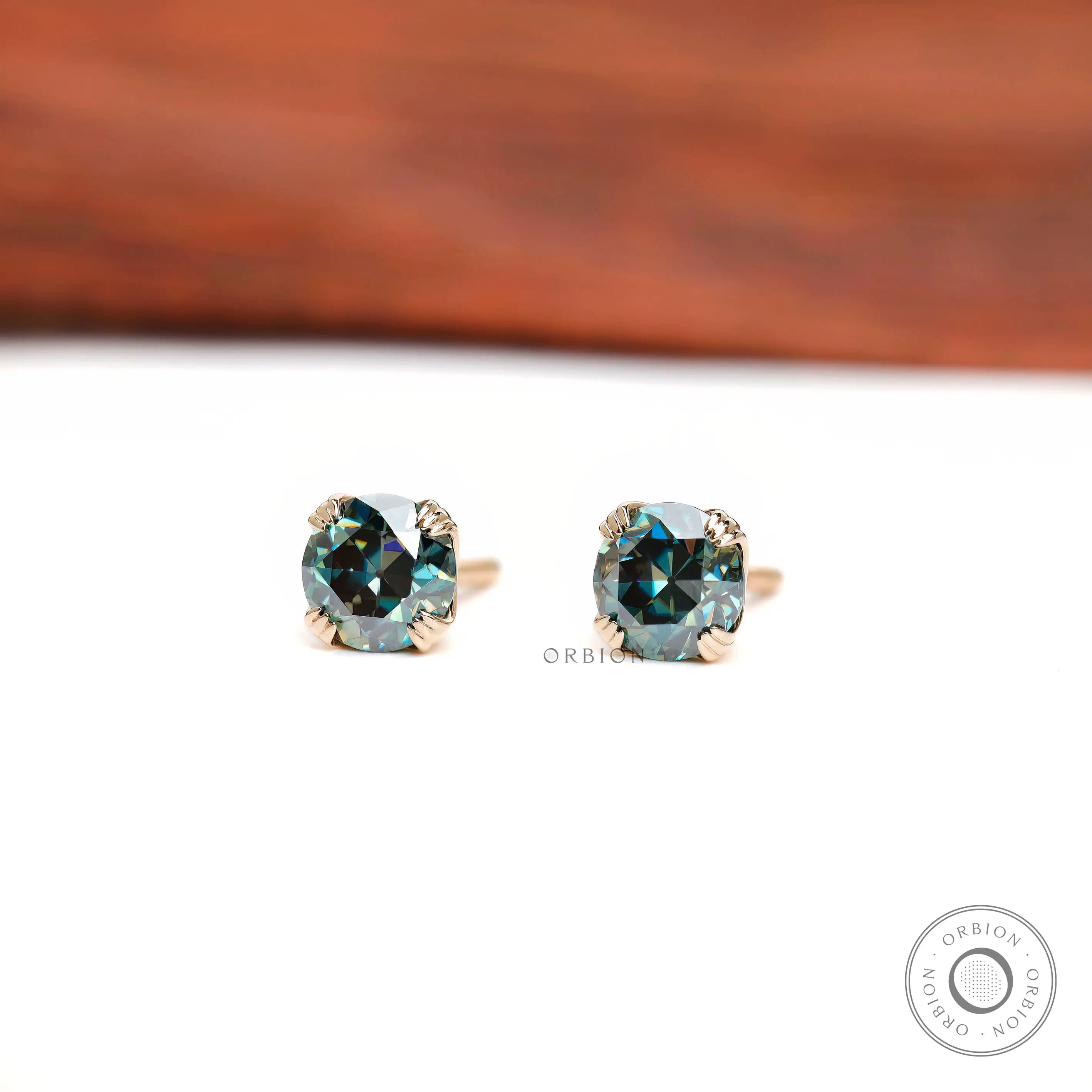 Vintage style round moissanite studs in yellow gold