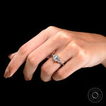 Yellow gold multi stone engagement ring on hand