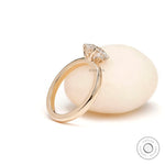 Side view of round moissanite solitaire engagement ring