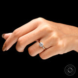 Round moissanite solitaire ring worn on hand