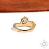Rear view highlighting thick gold band and sculpted setting