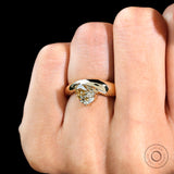 Front view of unique chunky pear moissanite solitaire ring