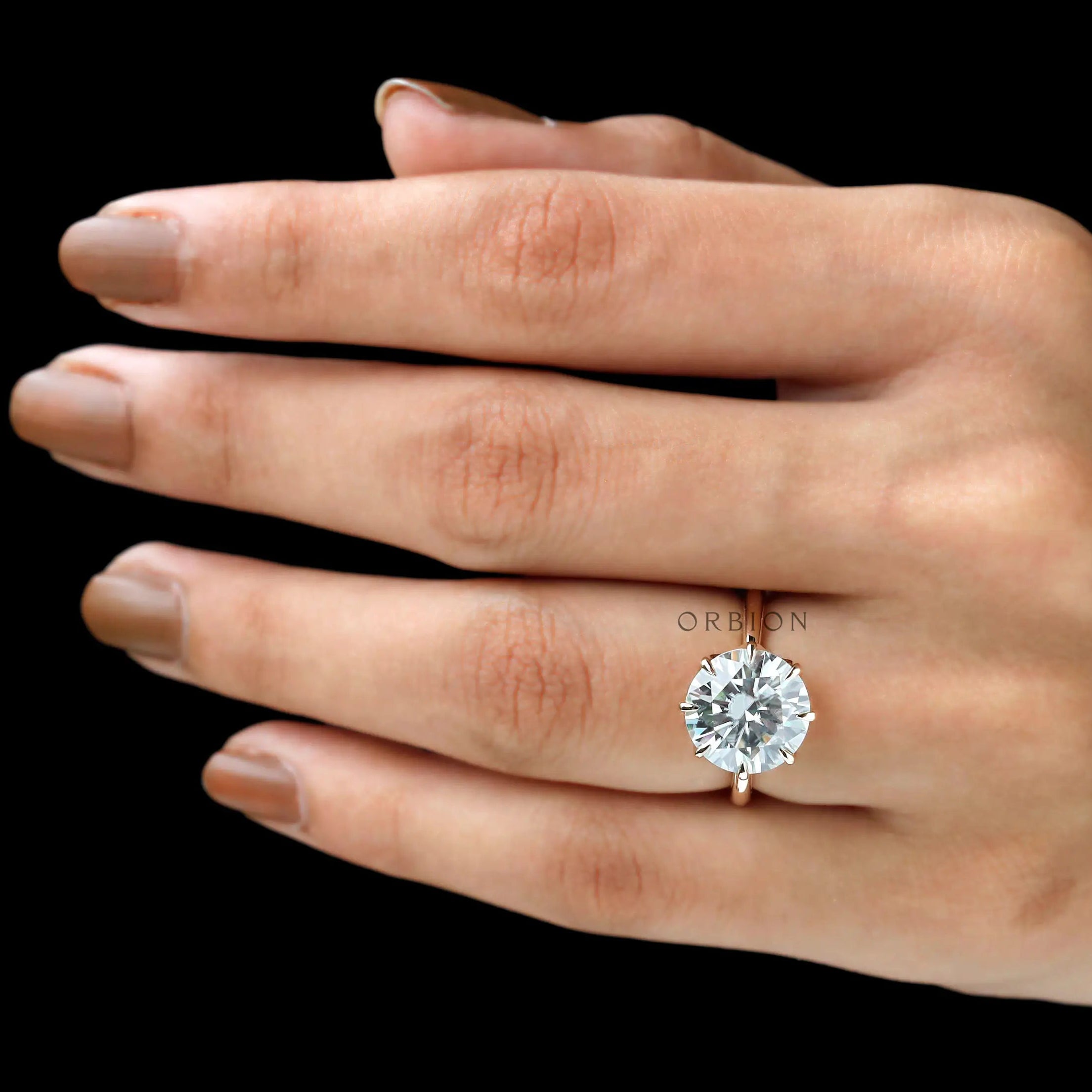 Side angle on hand displaying height and elegant tulip basket.