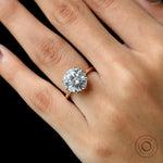 Close-up hand view highlighting brilliance of 11 mm round stone.