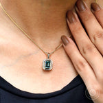 Blue green moissanite statement pendant on model