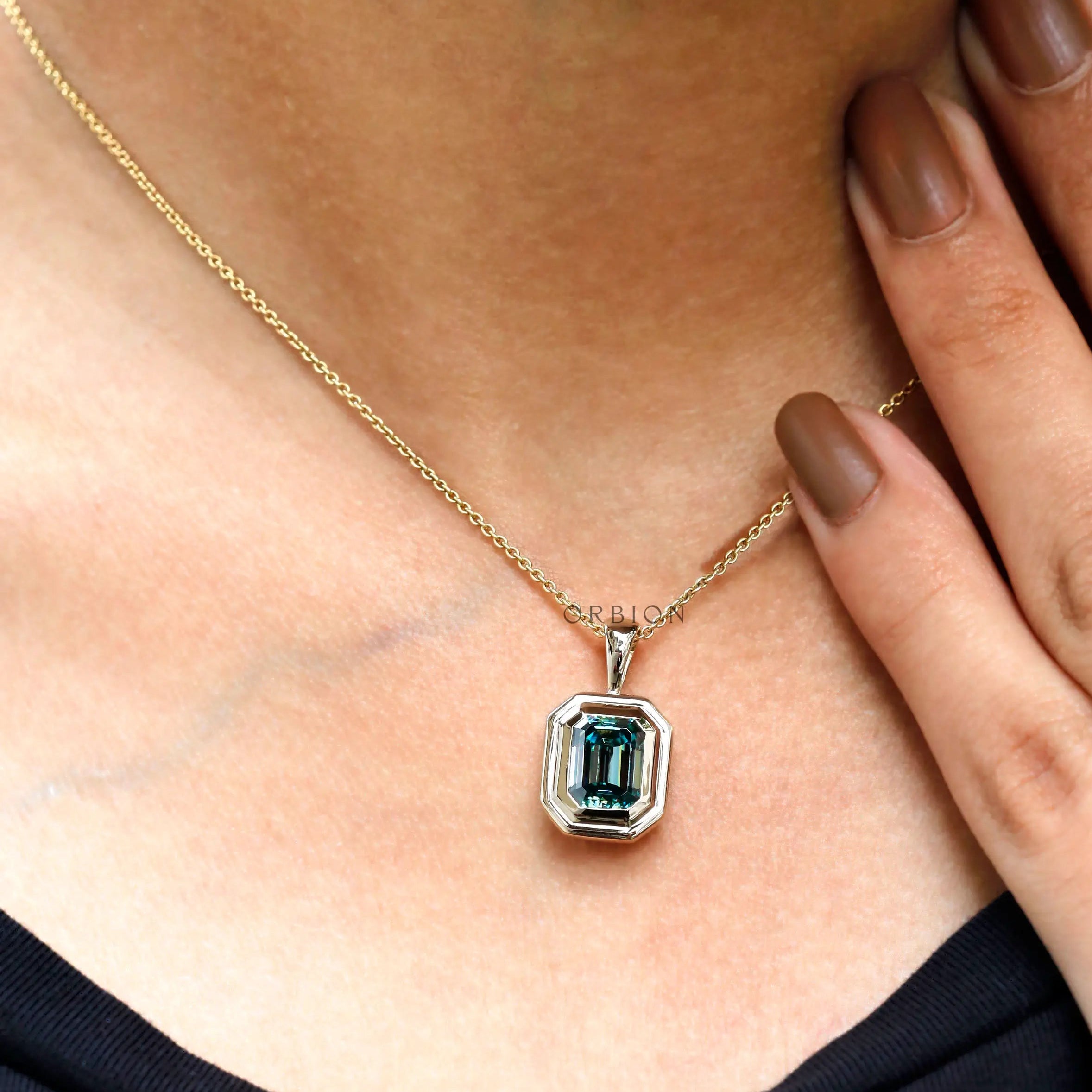 Blue green moissanite statement pendant on model