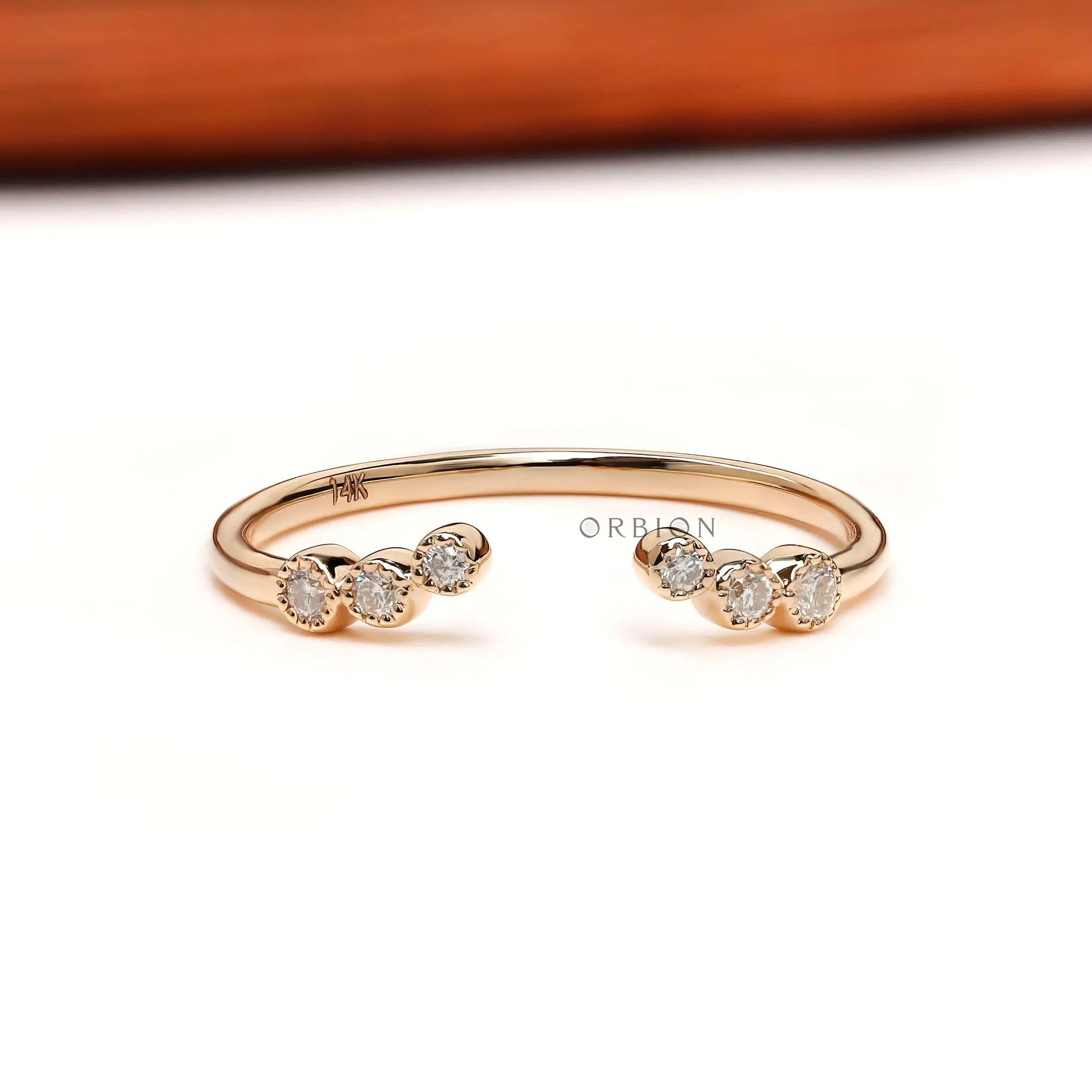 Open curved diamond stacking wedding band, front open-gap view