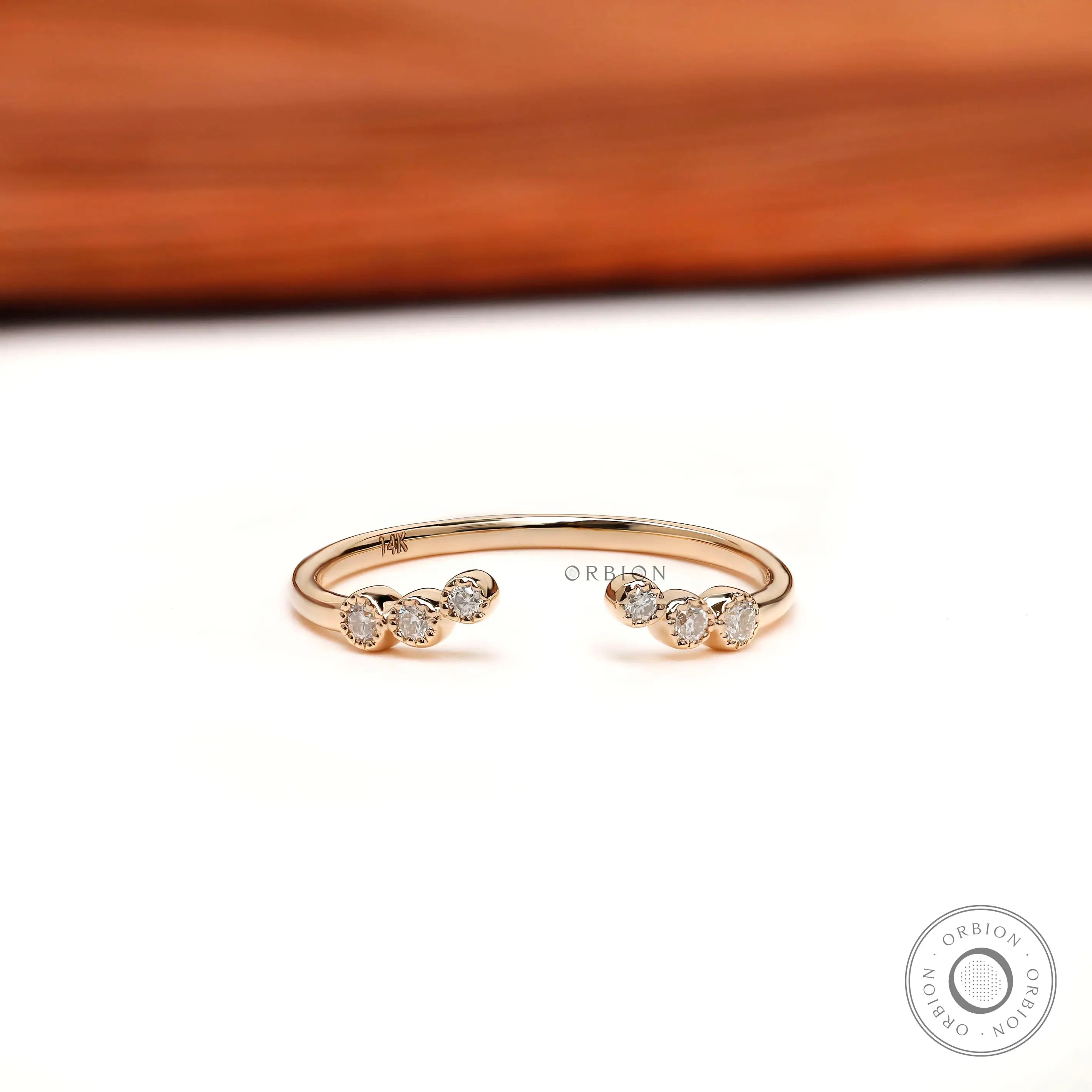 Open curved diamond stacking wedding band, front open-gap view