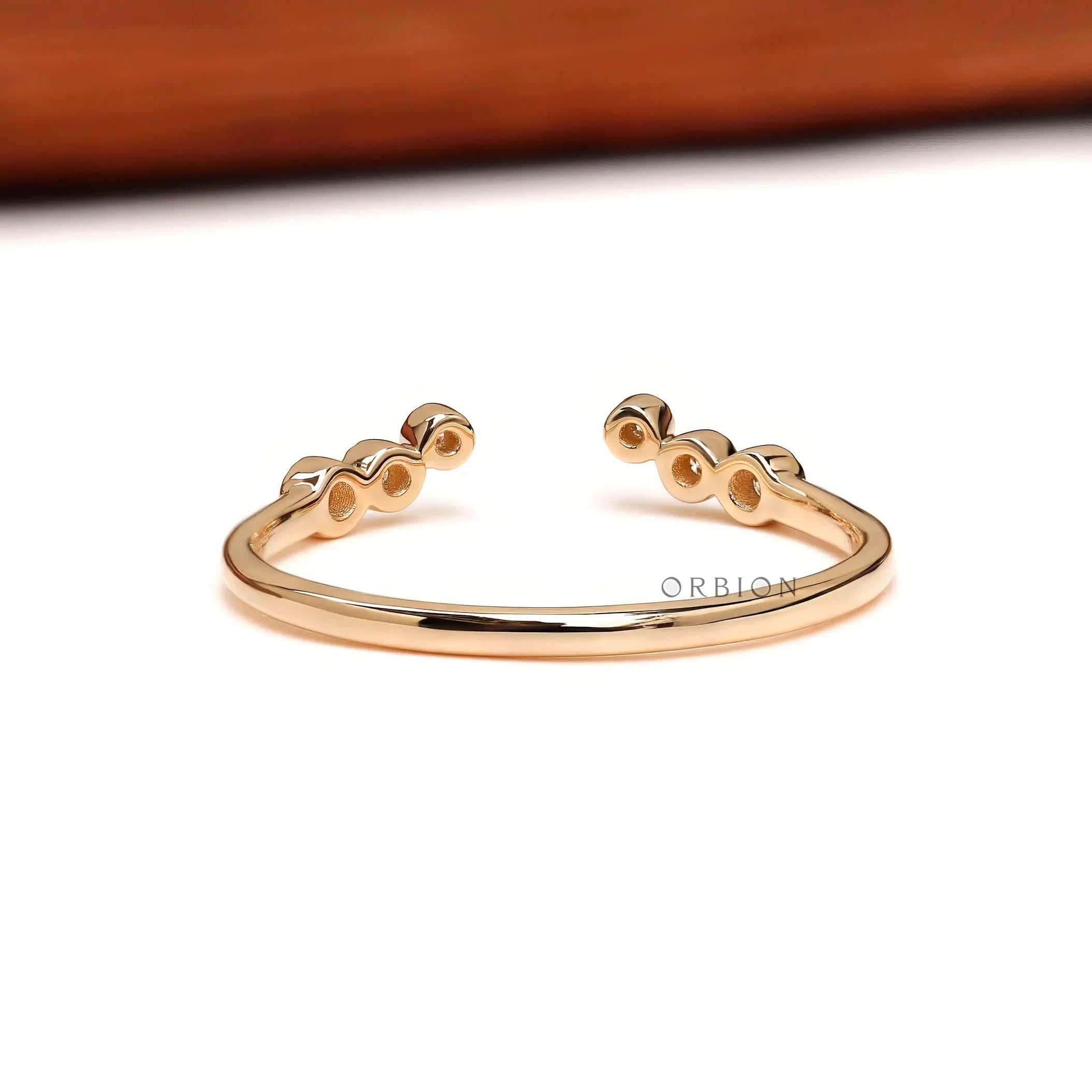 Open back view of curved stacking ring in 14K yellow gold