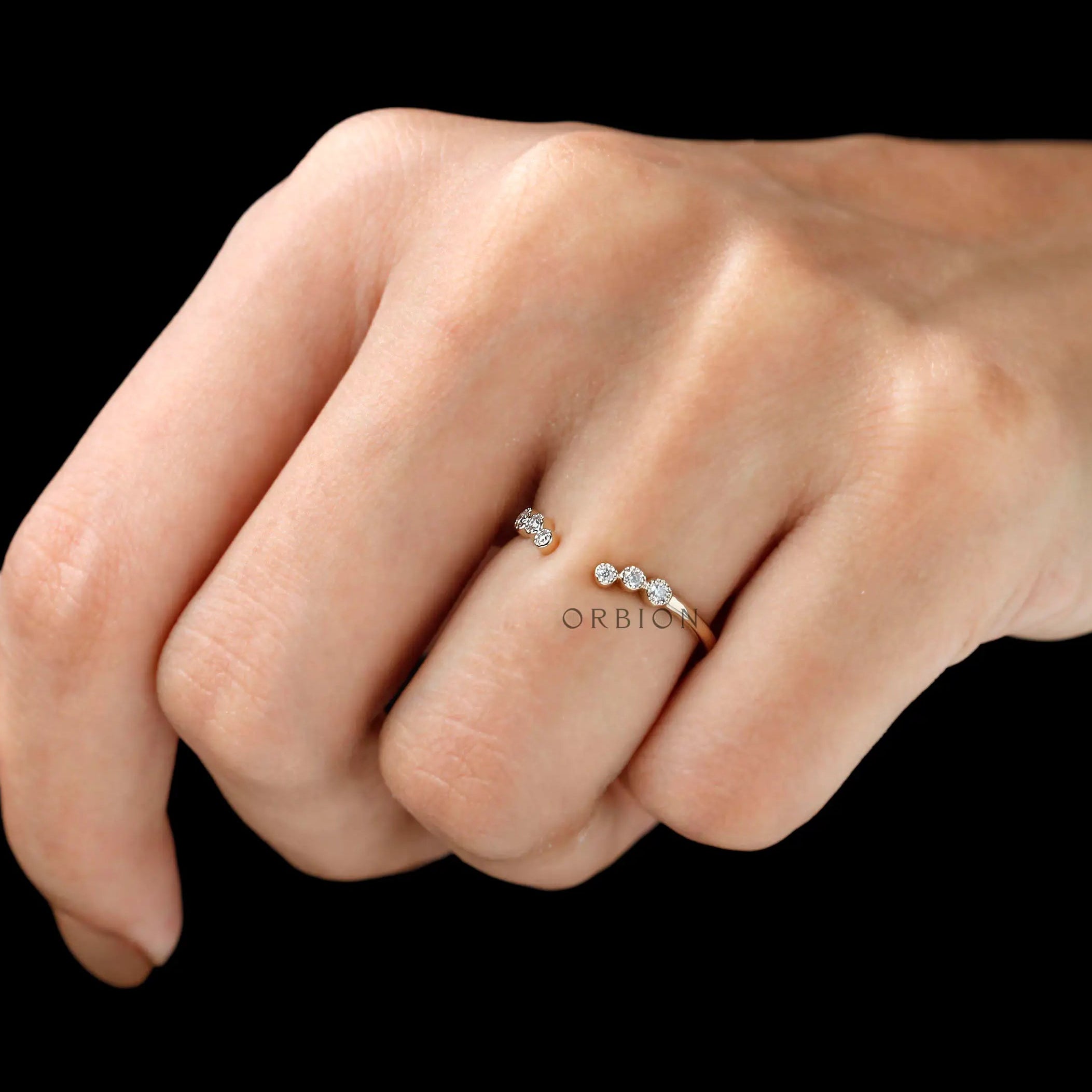 Open curved diamond stacking band worn on finger, minimalist everyday style
