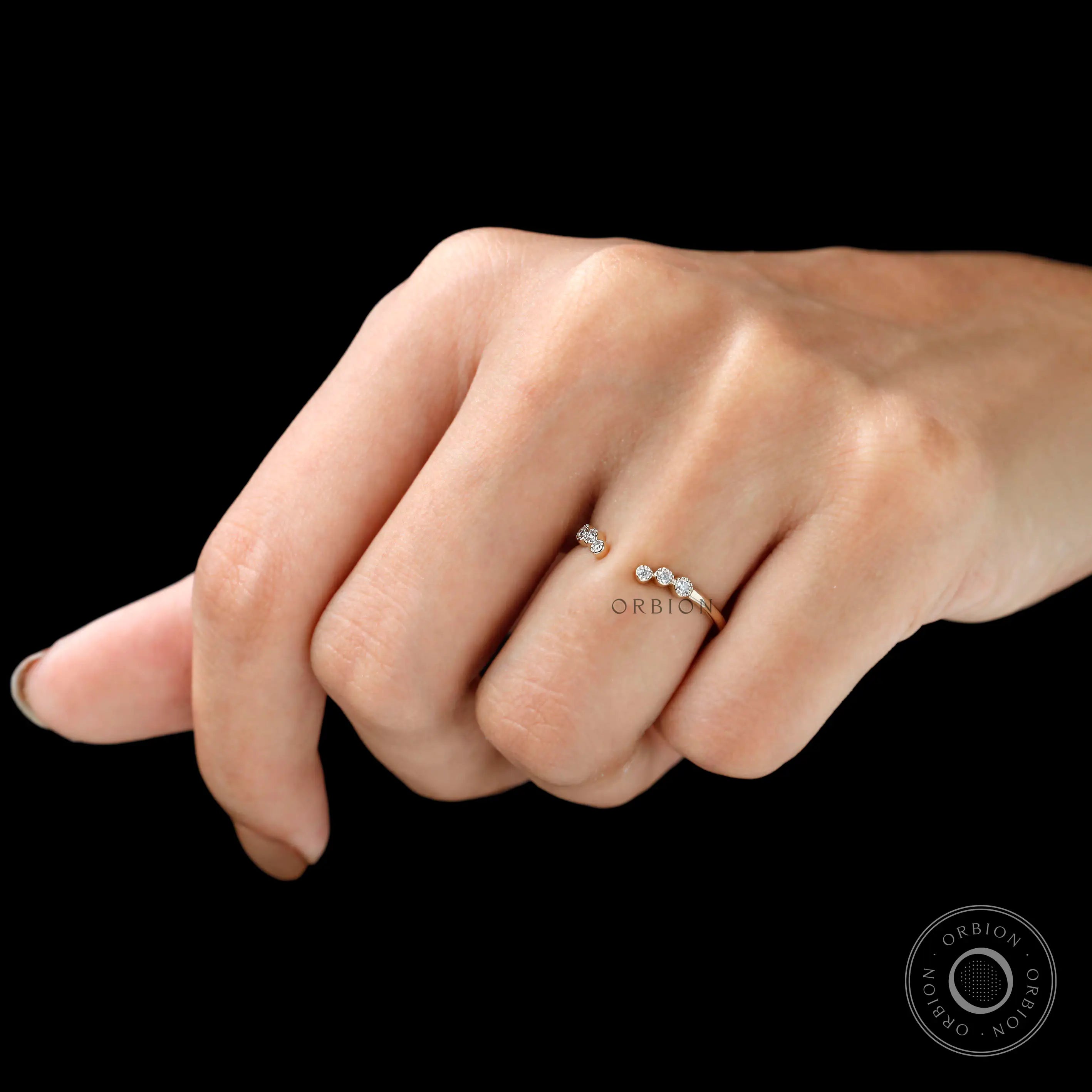 Open curved diamond stacking band worn on finger, minimalist everyday style