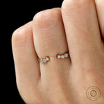 Delicate open diamond band stacked on hand, modern bridal look