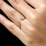 Open curved yellow gold diamond ring styled on hand, stacking inspiration