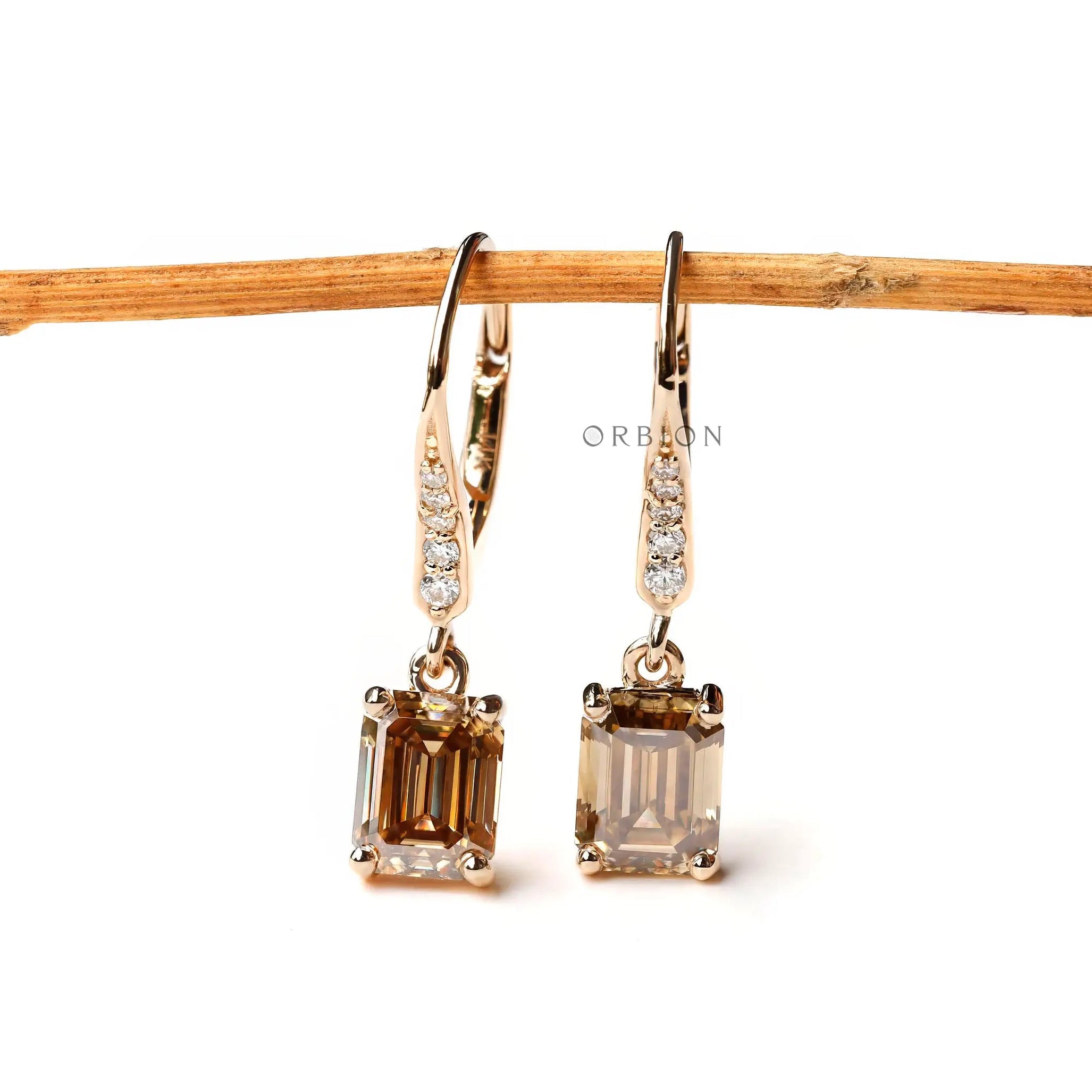 Dark champagne emerald cut moissanite drop earrings elegant design