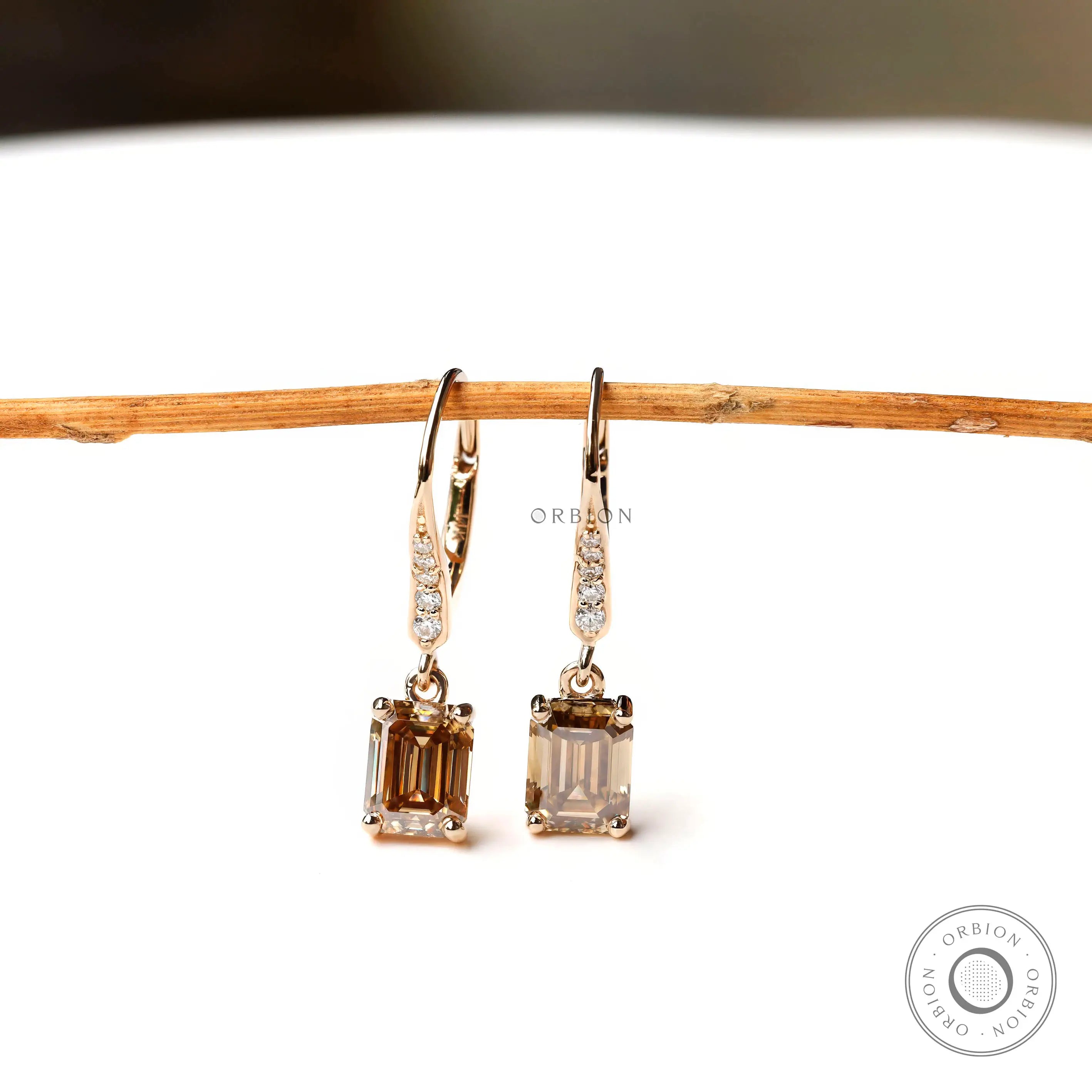 Dark champagne emerald cut moissanite drop earrings elegant design