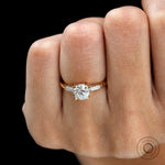 Vintage style round three stone engagement ring close up detail