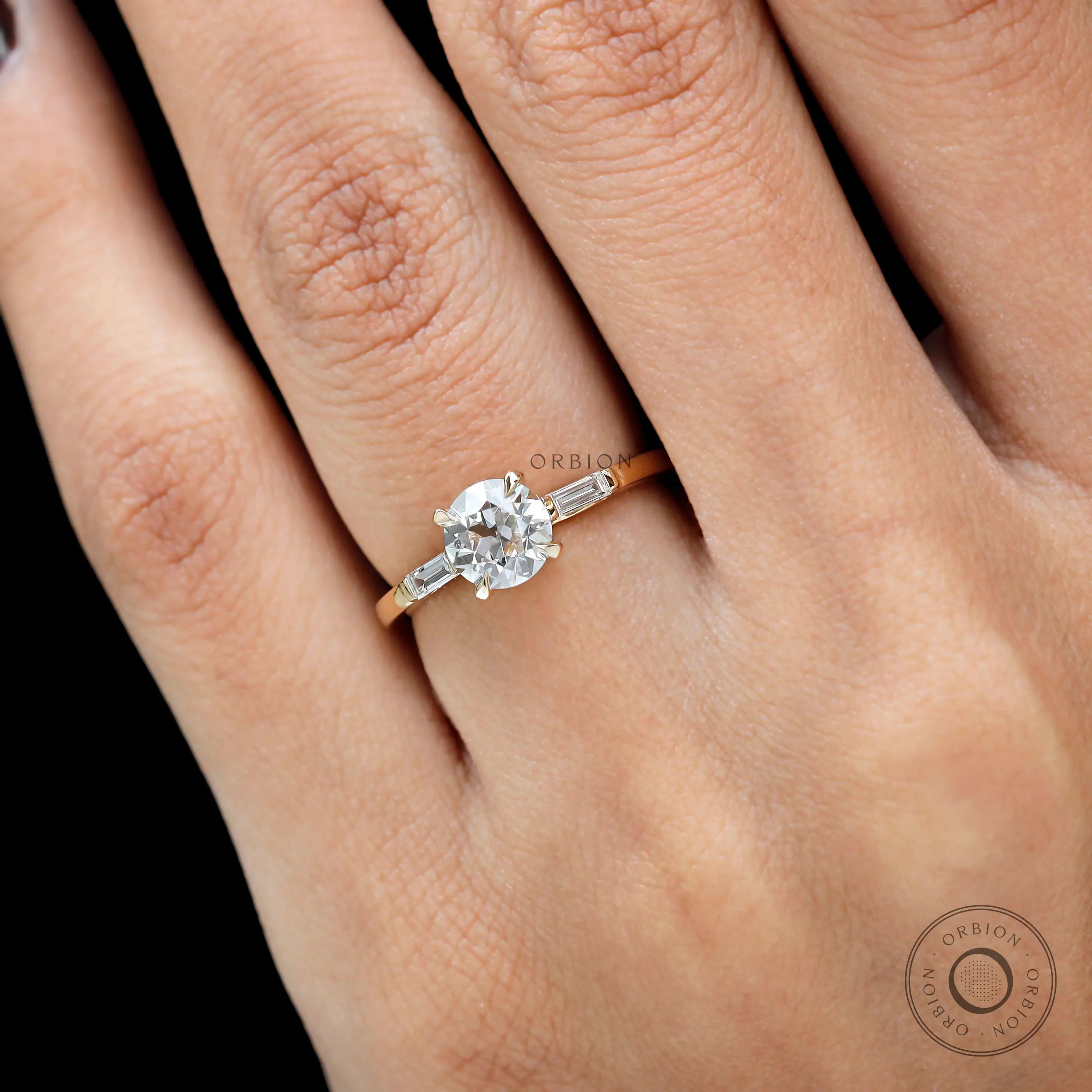Old European cut moissanite engagement ring on hand