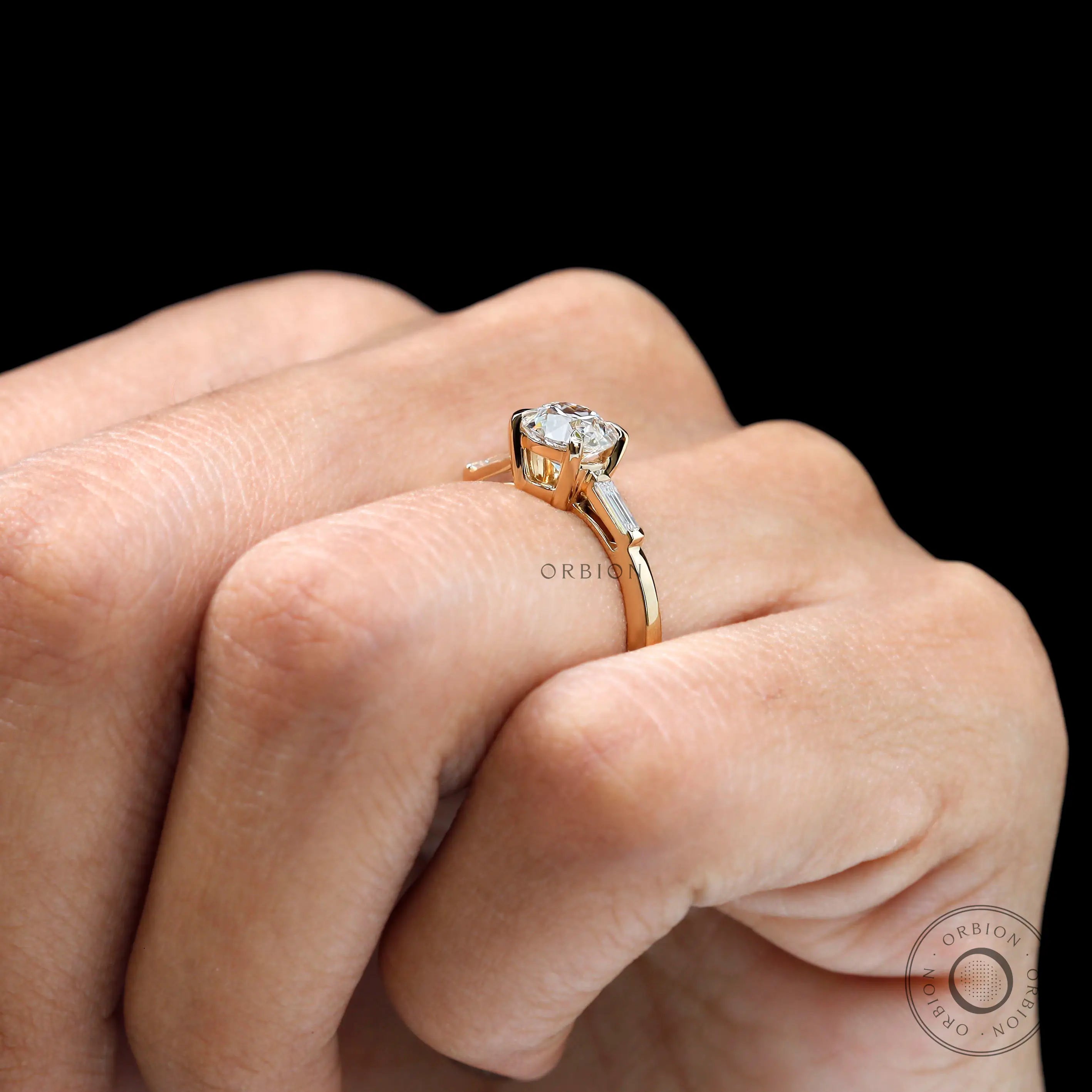Round antique cut engagement ring on finger