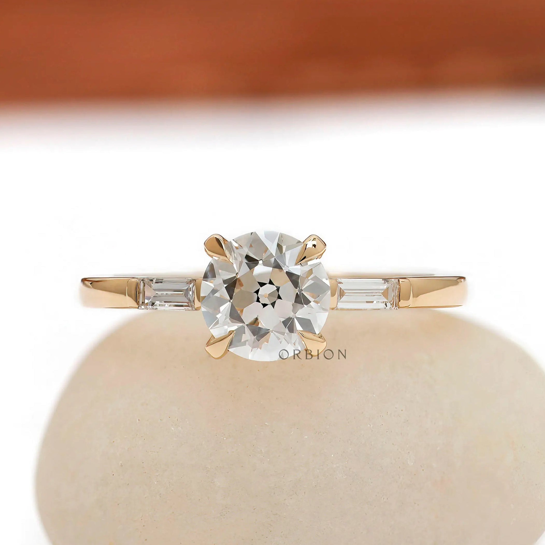 Old European cut three stone engagement ring in 14K yellow gold front view