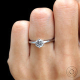 Round cut solitaire engagement ring showing prong setting