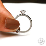 White gold round solitaire ring lifestyle hand shot