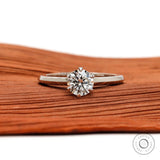 Round cut solitaire engagement ring in 10K white gold front view
