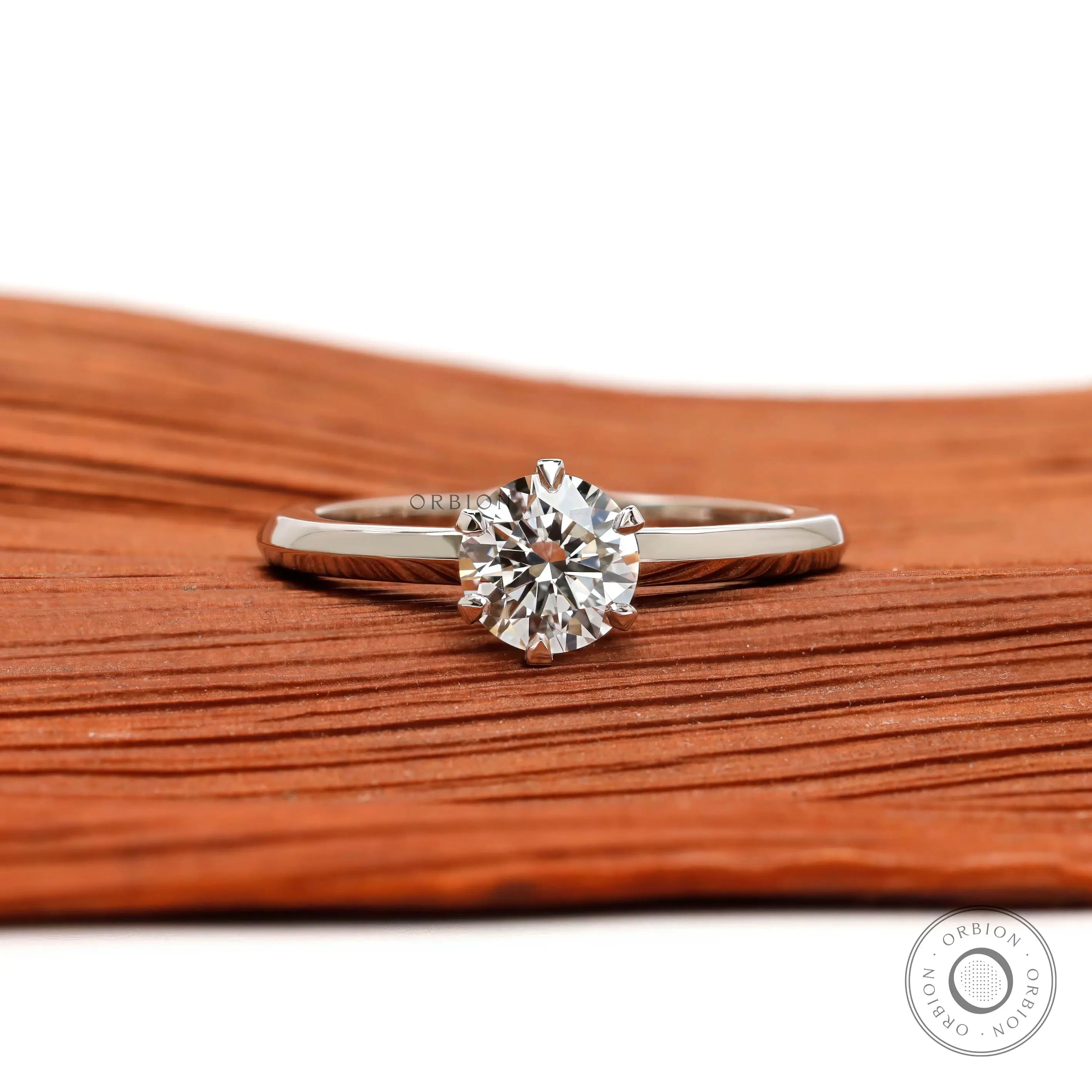 Round cut solitaire engagement ring in 10K white gold front view