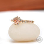 Heart shaped pink diamond halo engagement ring