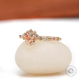 Heart shaped pink diamond halo engagement ring