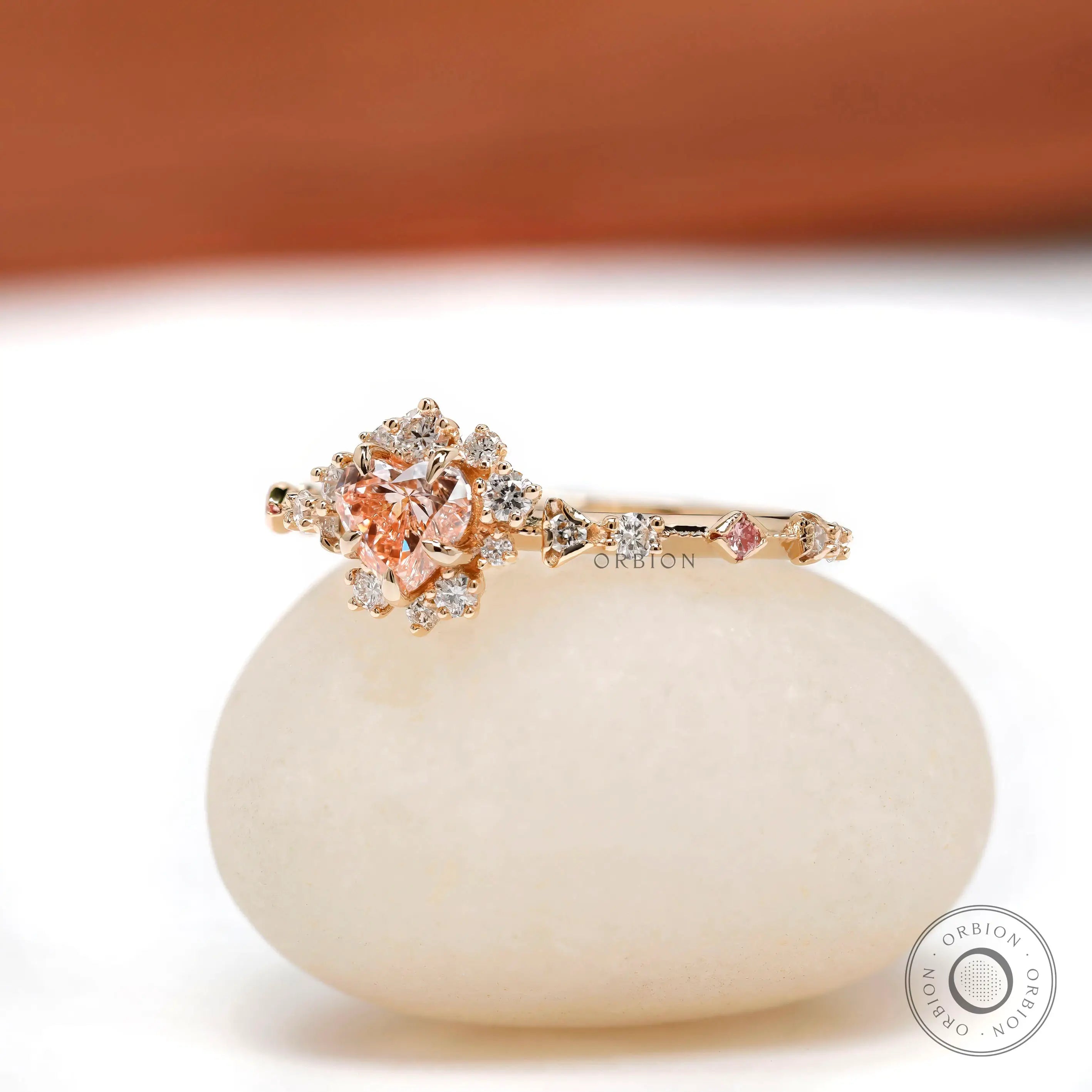 Heart shaped pink diamond halo engagement ring
