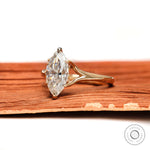 Marquise moissanite solitaire ring side profile in yellow gold
