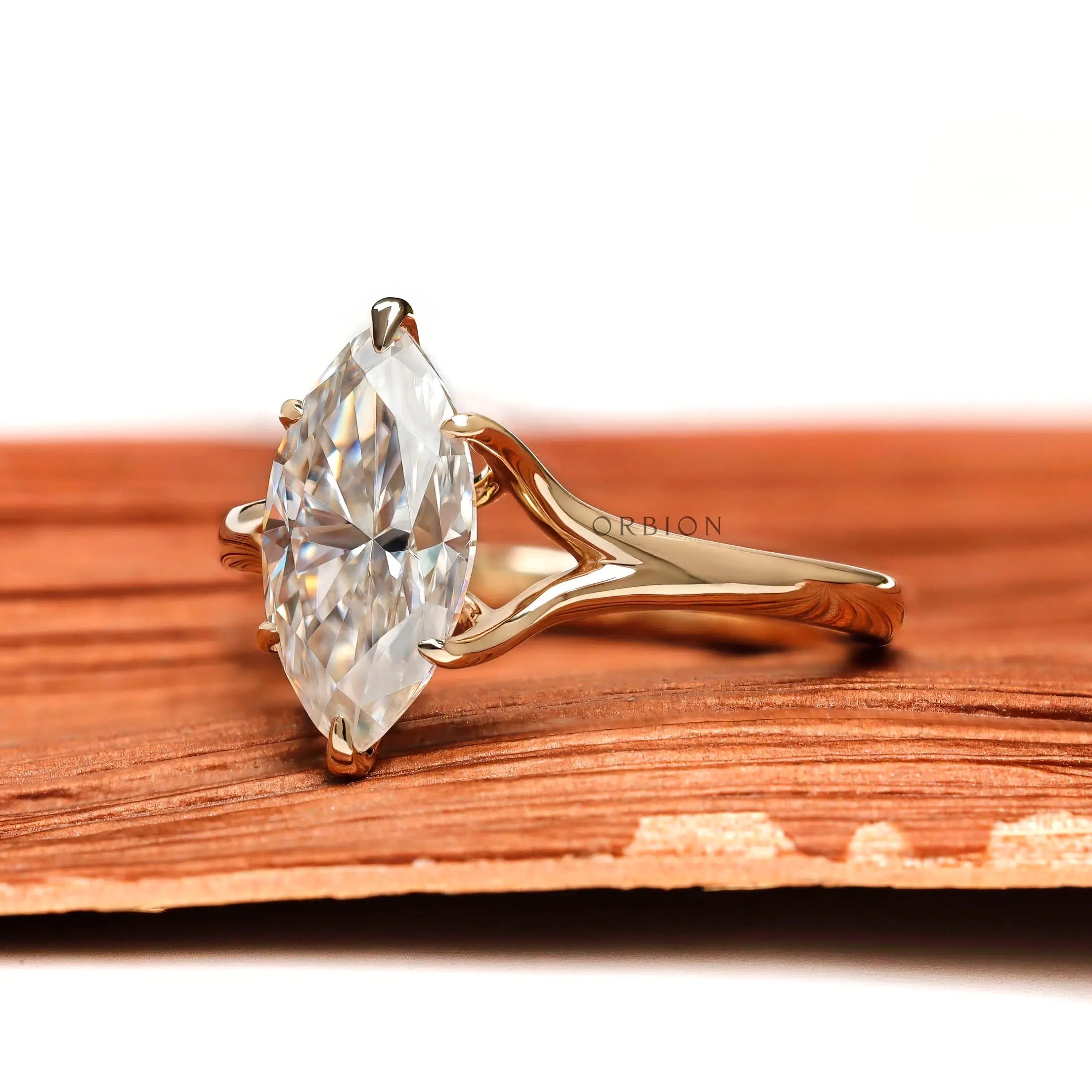 Marquise moissanite solitaire ring side profile in yellow gold