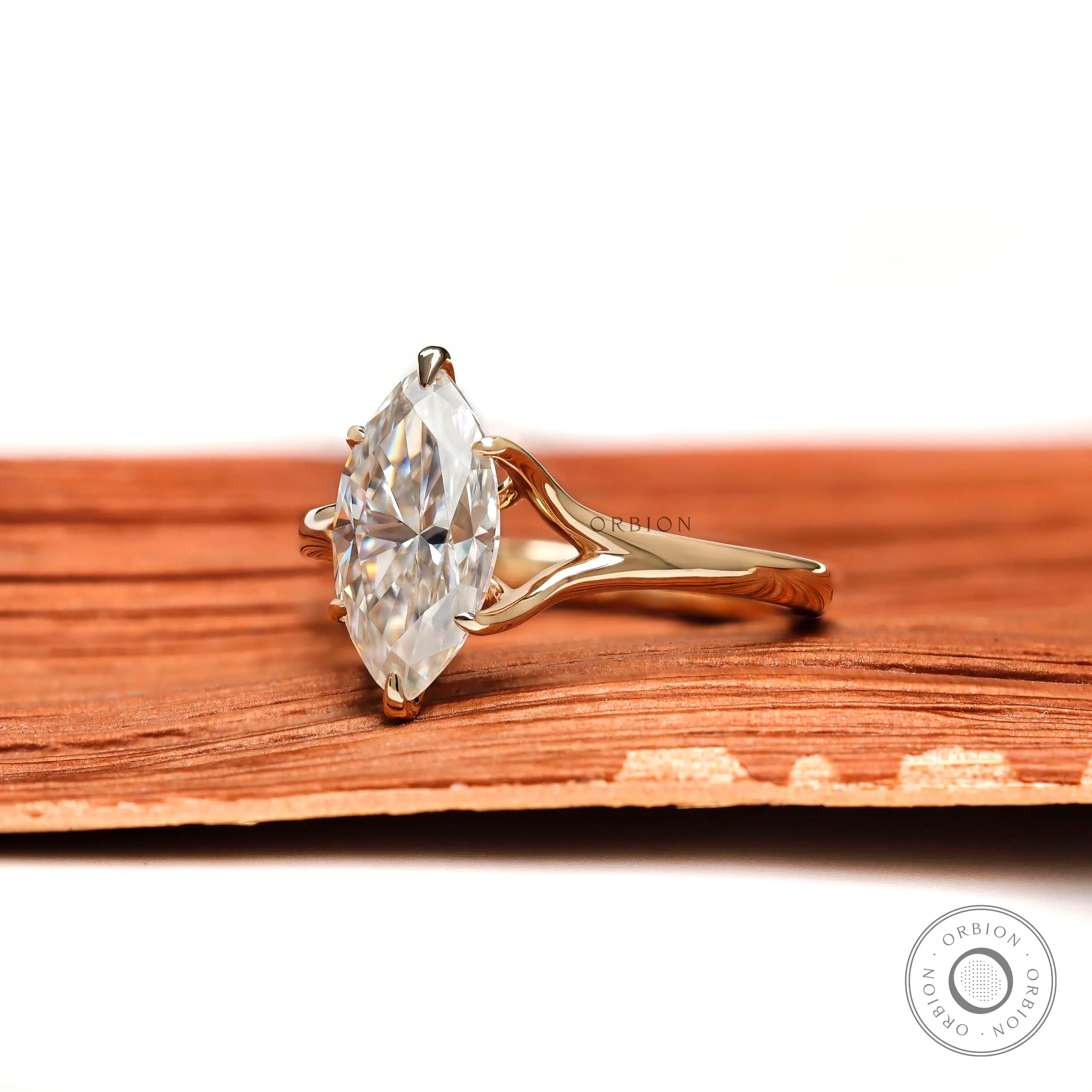 Marquise moissanite solitaire ring side profile in yellow gold