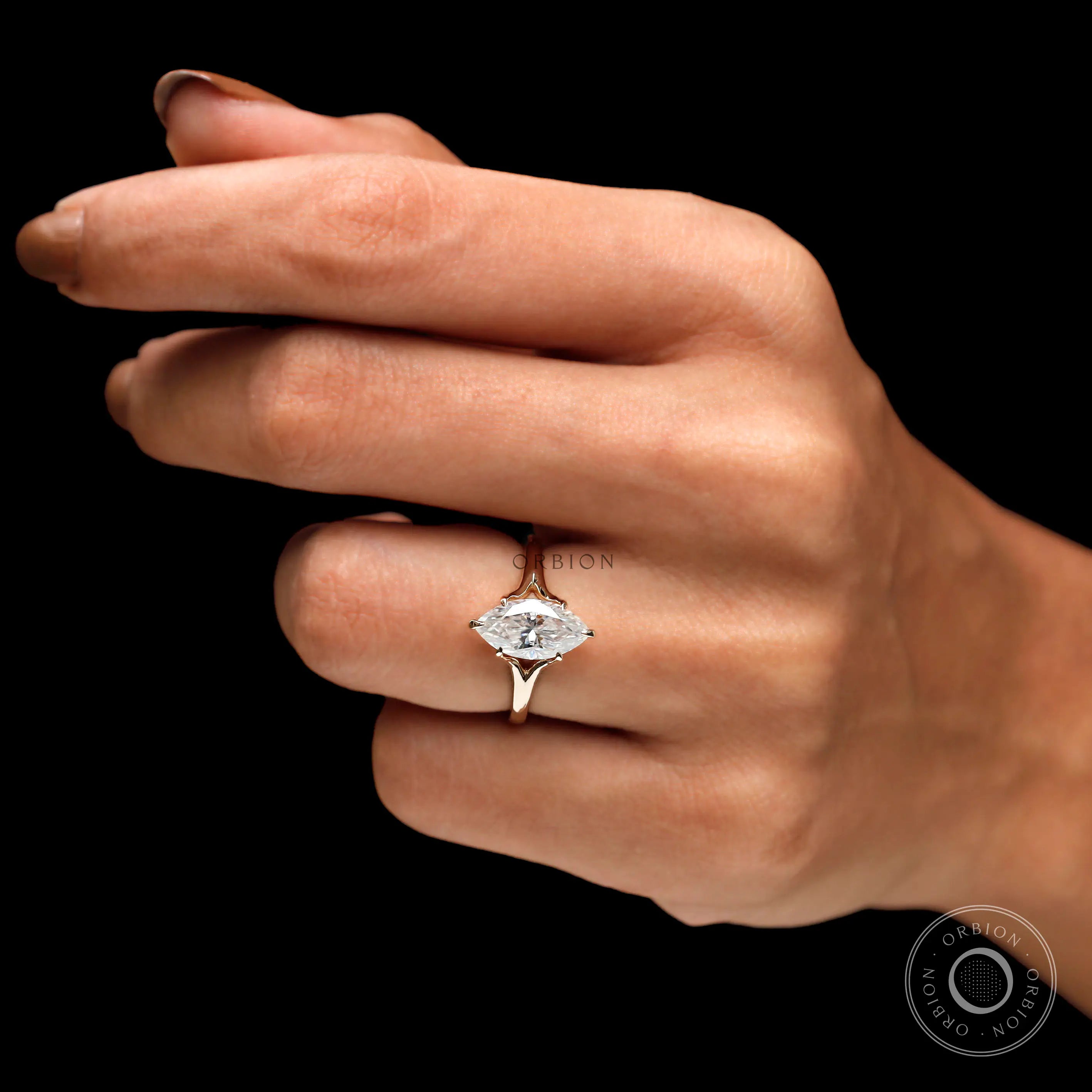 Marquise moissanite ring worn on hand front view