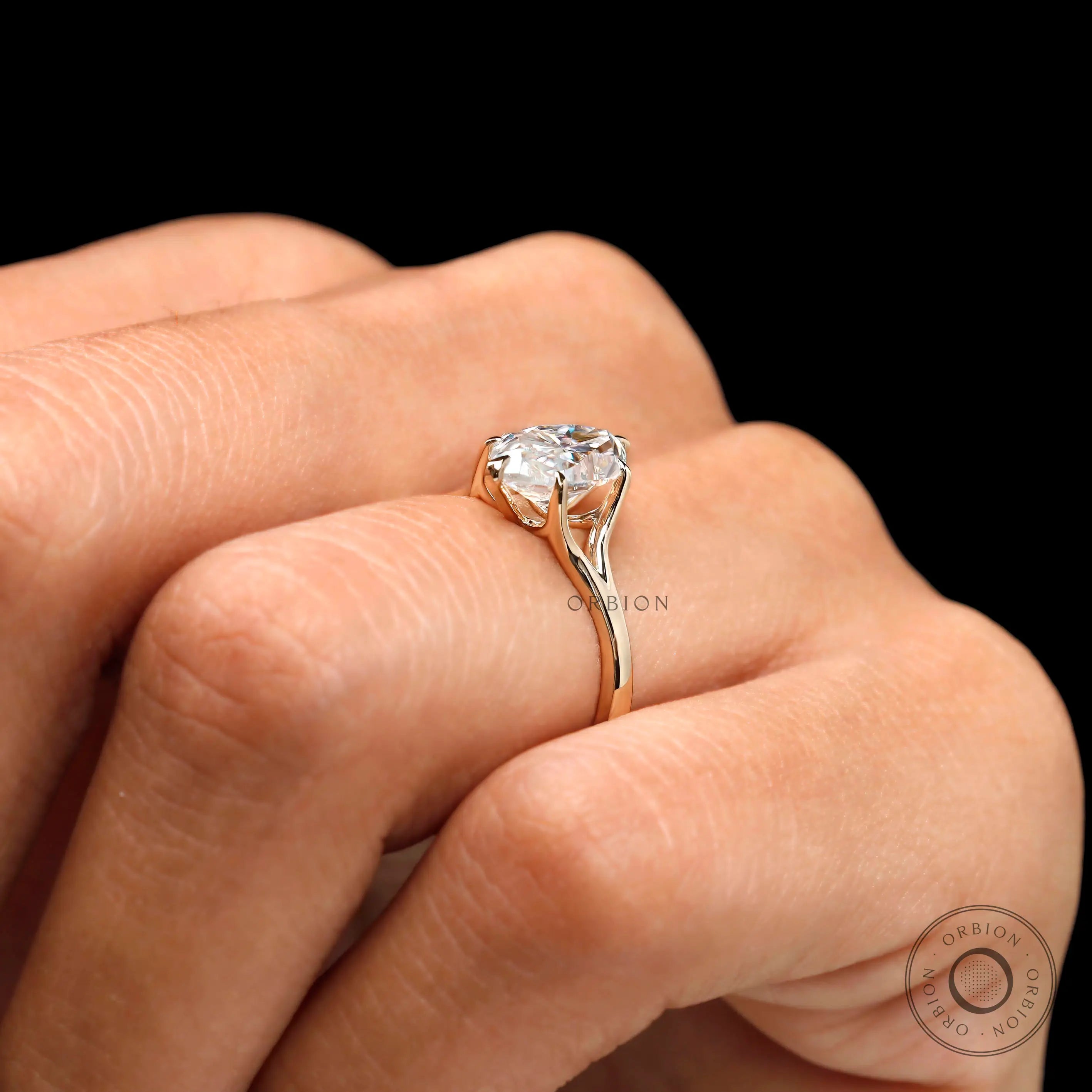 Side profile marquise moissanite ring on finger