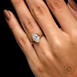 Top view marquise moissanite solitaire on hand