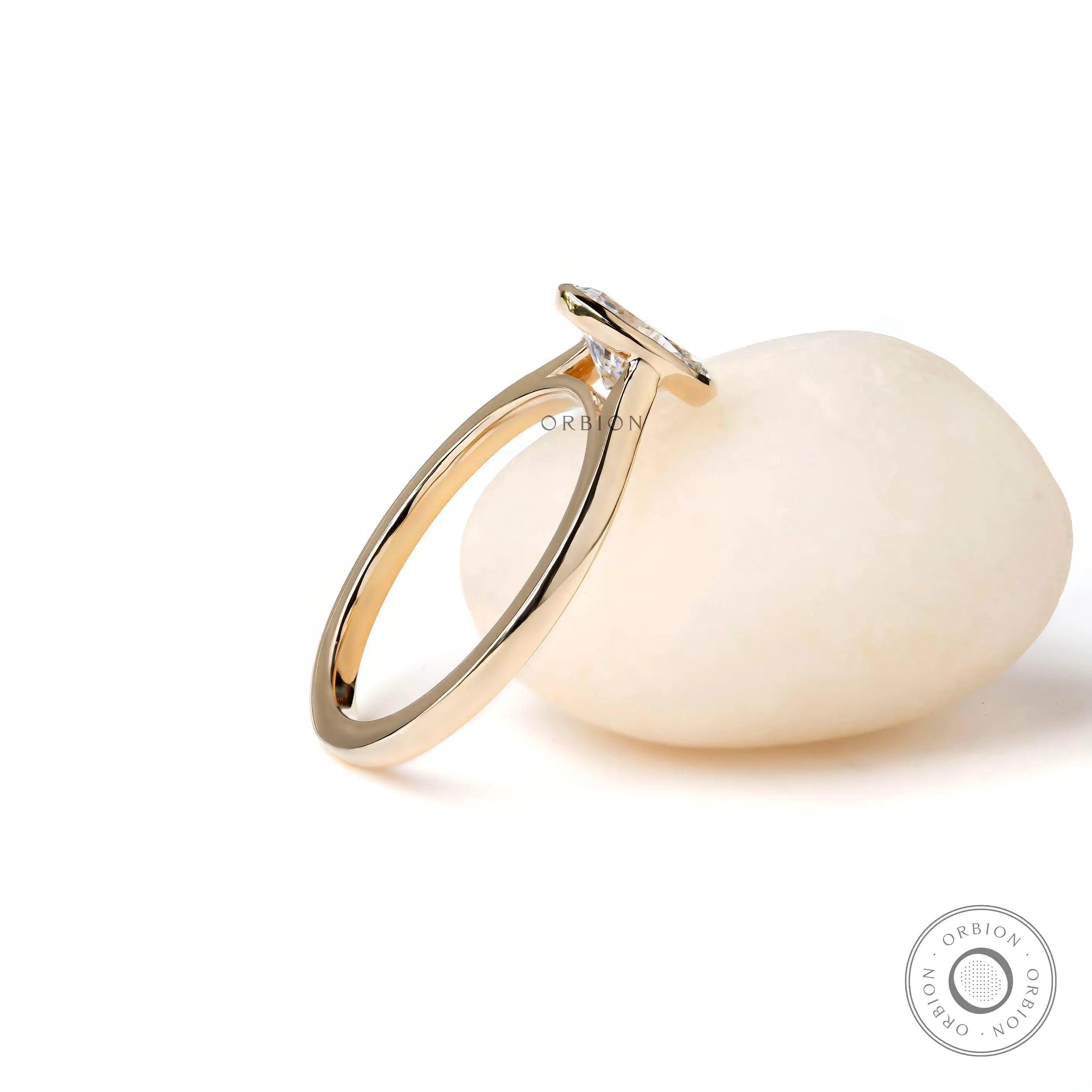 Side profile oval bezel lab diamond ring on white stone