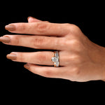 Stacked oval bezel ring with baguette band on hand