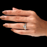 Stacked oval bezel ring with baguette band on hand