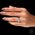 Top worn view of oval solitaire ring set on hand