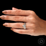Top worn view of oval solitaire ring set on hand