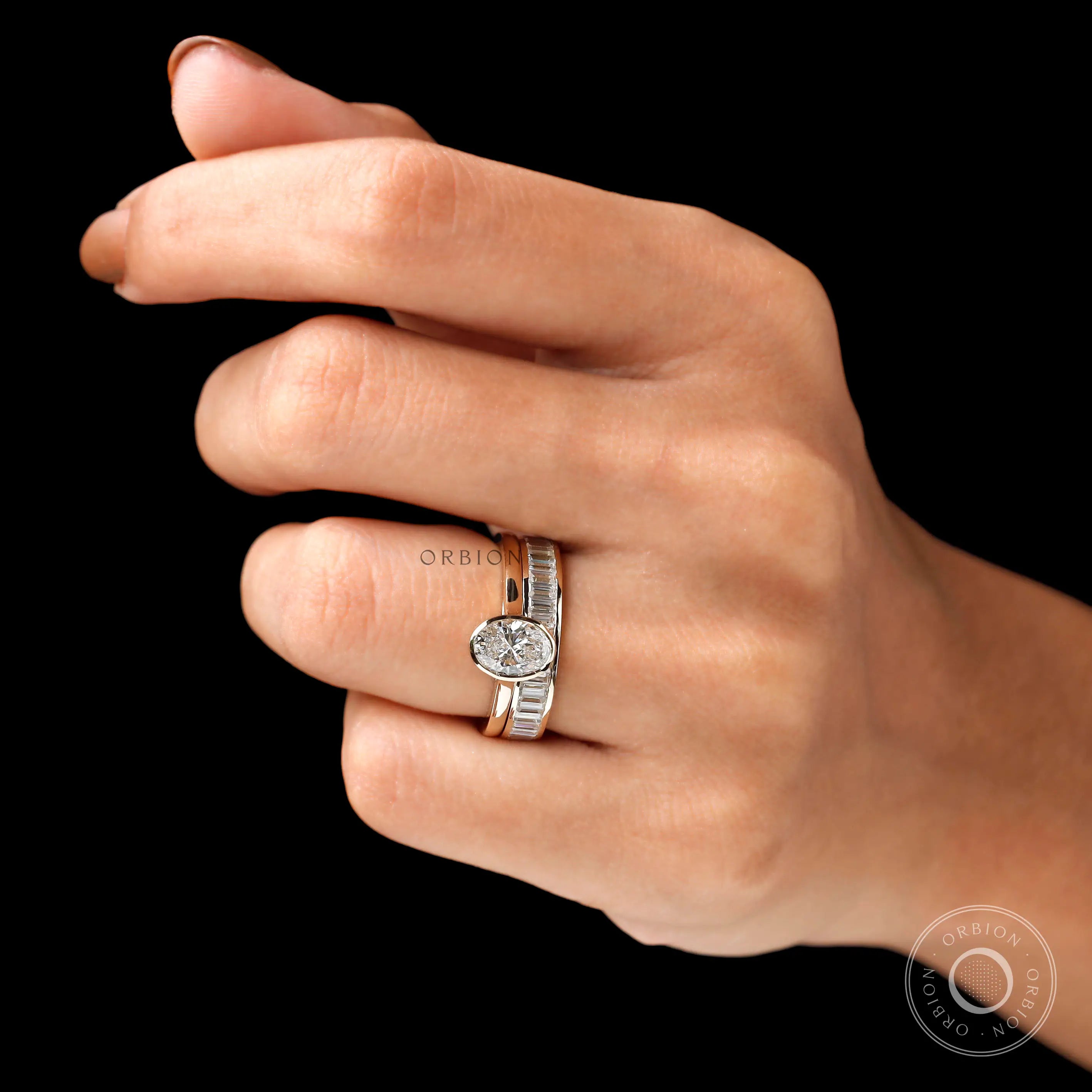 Angled worn view of oval solitaire ring set on hand