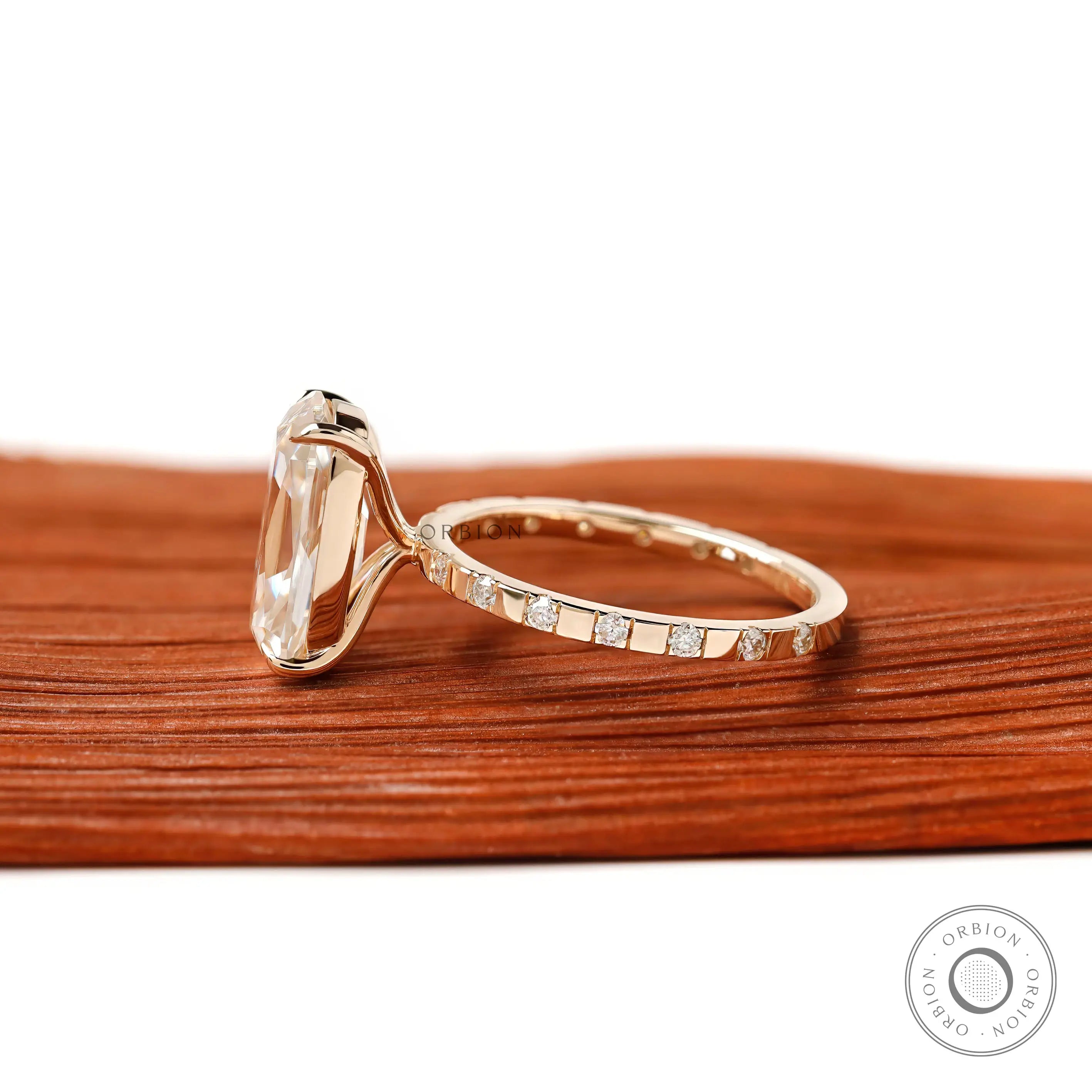 Side profile elongated cushion moissanite ring with accent stones
