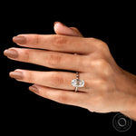 On-hand top view showcasing elongated cushion center stone